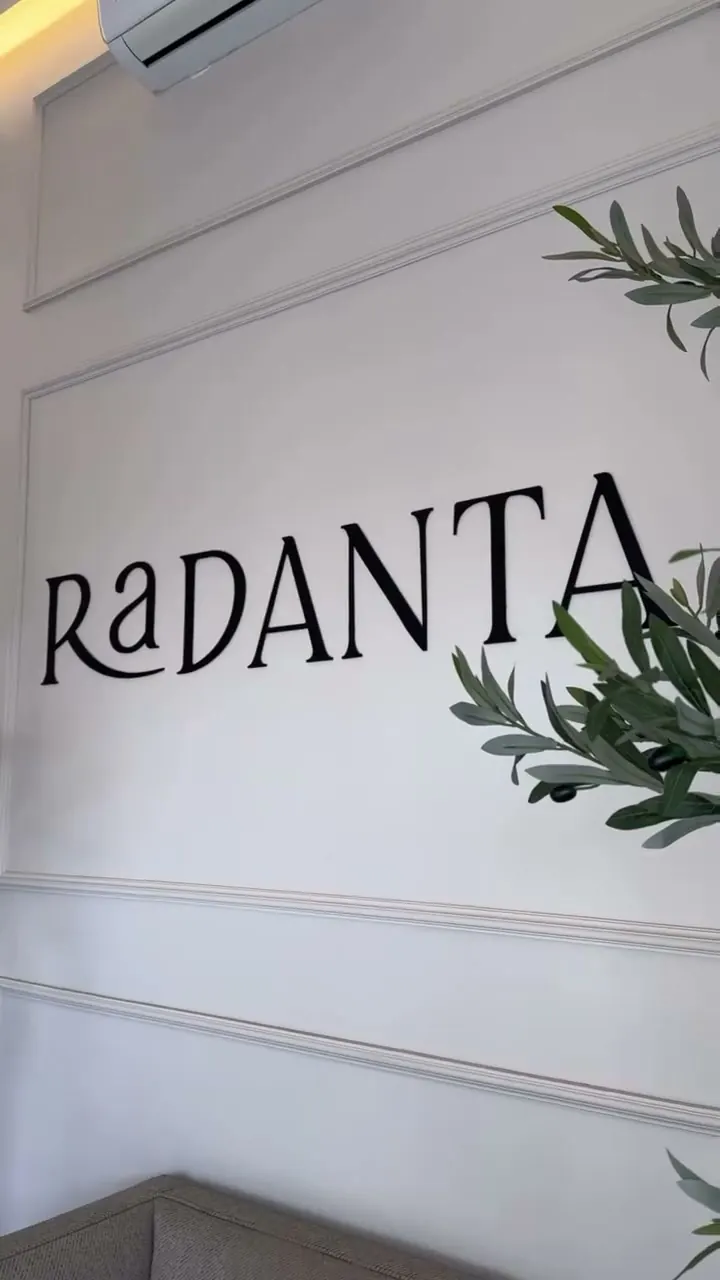 The RaDANTA name on the wall, with olive branches.